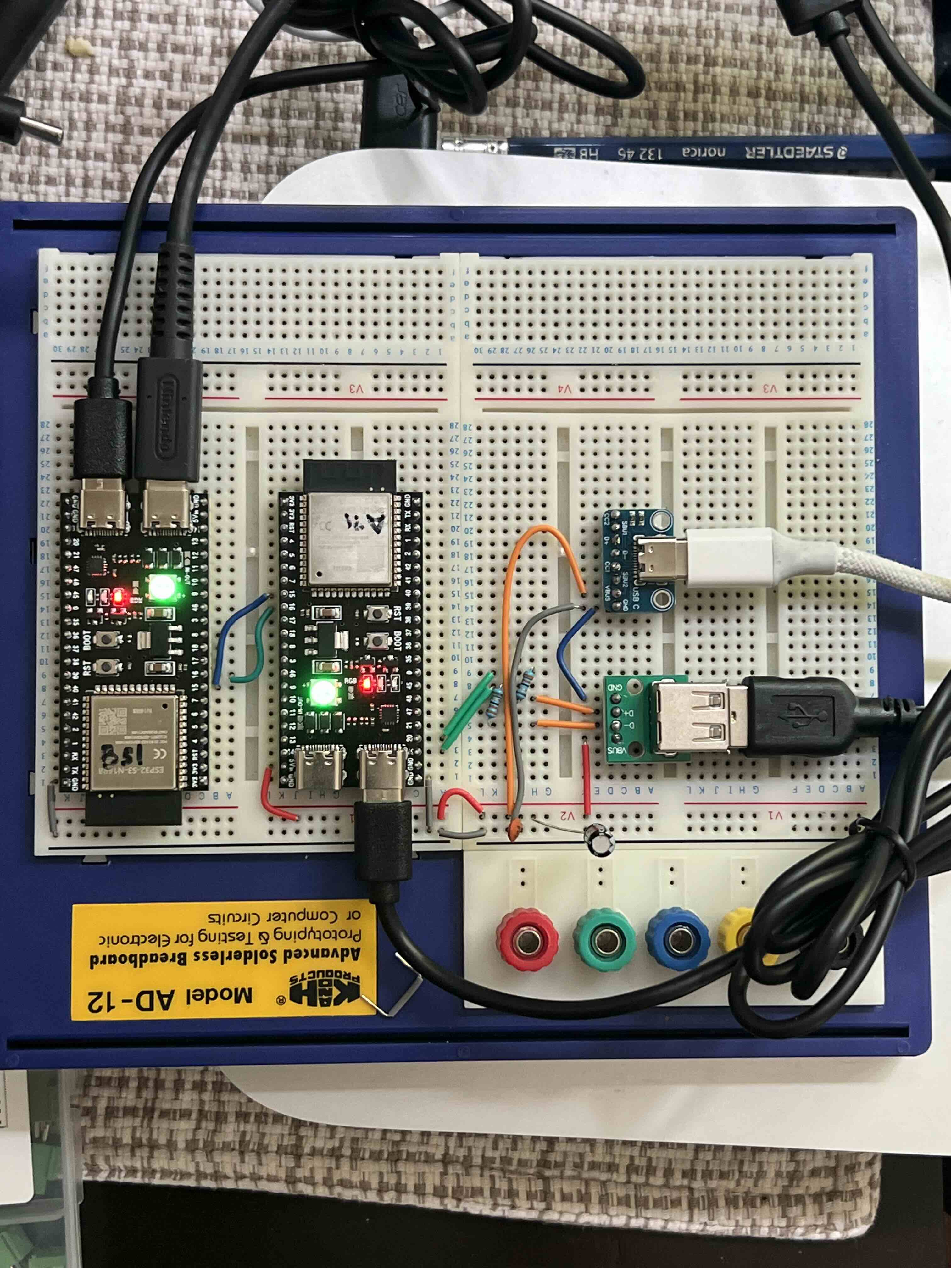 The two ESP32-S3 boards wired up on a solderless breadboard during prototyping